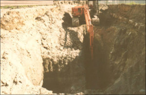 Once testing has determined contamination is present, excavation of contaminated soil can be an effective solution for remediating a site. Here, a deep excavation in dense (till) soil with low water table conditions was needed in an area contaminated by a leaking underground gasoline tank.